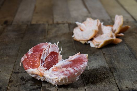 Picked grapefruit on a wooden table, juices and peaches, old kitchen