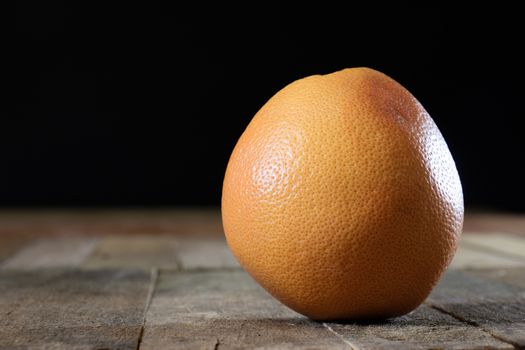 Picked grapefruit on a wooden table, juices and peaches, old kitchen