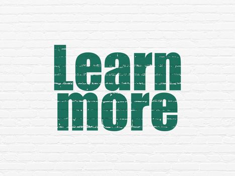 Learning concept: Painted green text Learn More on White Brick wall background