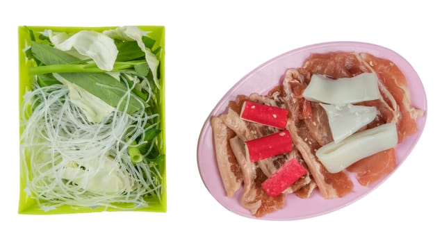 top view raw pork on plate  and vegetable in basket isolated on white background