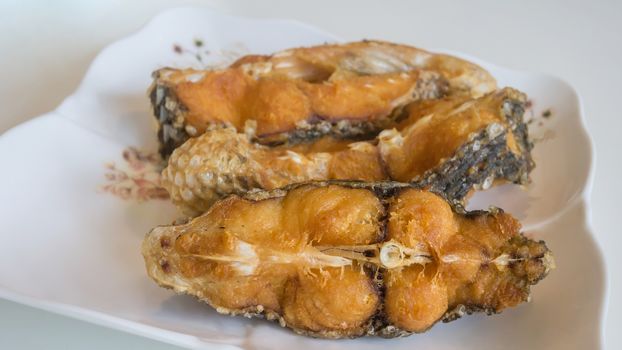 Crispy fish pieces, close up seafood dish