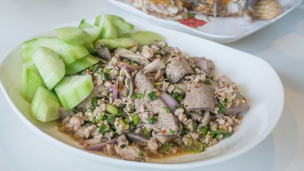 mixed fresh vegetable , minced pork and steamed liver , Thai spicy salad