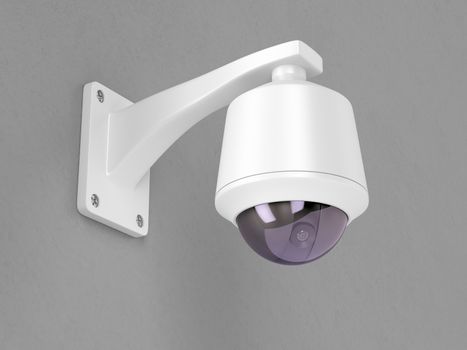 Surveillance camera attached on grey wall