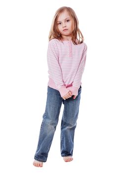 Serious shy five years girl standing  isolated on white
