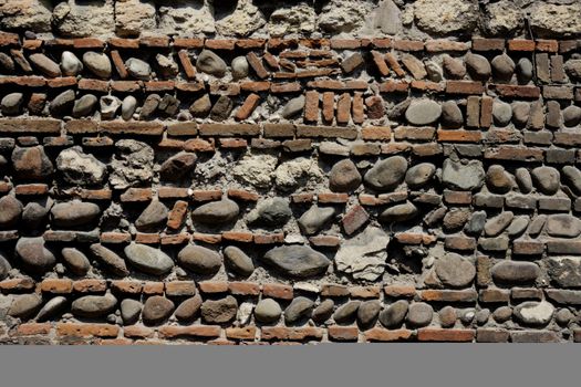Seamless rock stone background for design and decorate. Detail of the real wall in Verona.