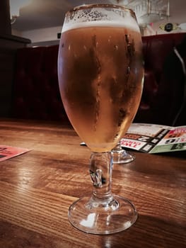 Tasty and gold beer in glass. Restaurant beer concept.