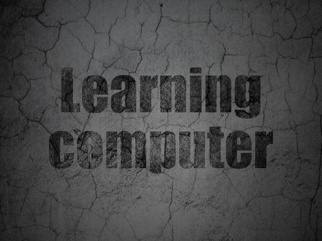 Learning concept: Black Learning Computer on grunge textured concrete wall background