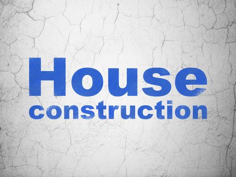 Constructing concept: Blue House Construction on textured concrete wall background