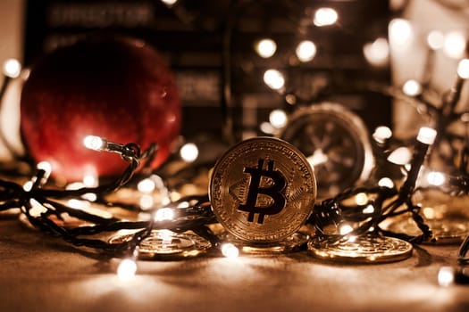 Digital currency physical metal bitcoin coin. Christmas cryptocurrency concept.