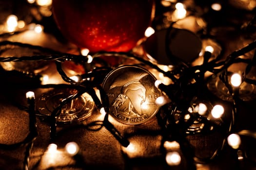 Digital currency physical metal bitcoin coin. Christmas cryptocurrency concept.
