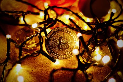 Digital currency physical metal bitcoin coin. Christmas cryptocurrency concept.