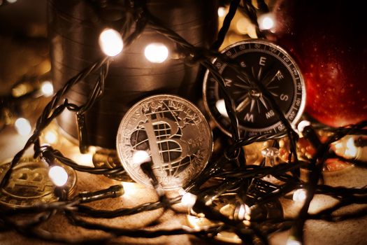 Digital currency physical metal bitcoin coin. Christmas cryptocurrency concept.