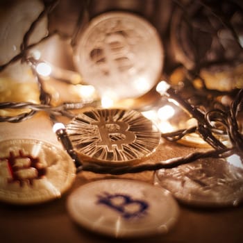 Digital currency physical metal bitcoin coin. Christmas cryptocurrency concept.