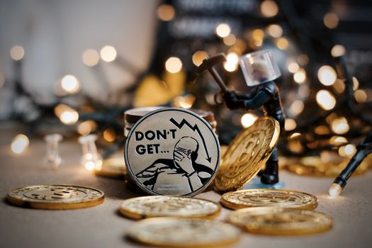 Digital currency physical metal coin. Christmas cryptocurrency concept.