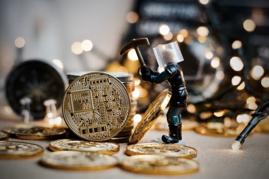 Digital currency physical metal coin. Christmas cryptocurrency concept.