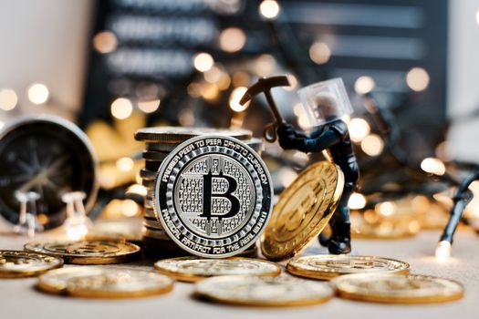 Digital currency physical metal coin. Christmas cryptocurrency concept.