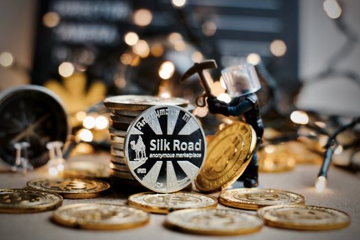 Digital currency physical metal coin. Christmas cryptocurrency concept.