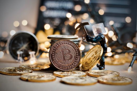 Digital currency physical metal coin. Christmas cryptocurrency concept.