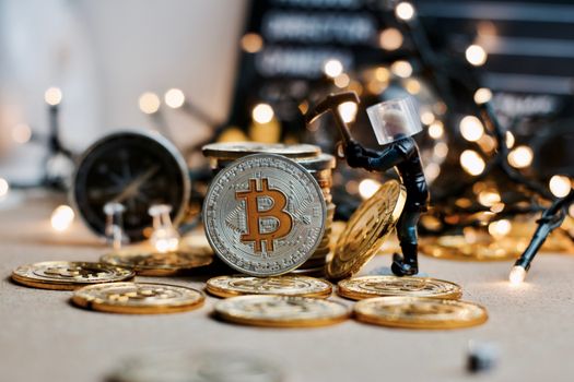 Digital currency physical metal coin. Christmas cryptocurrency concept.