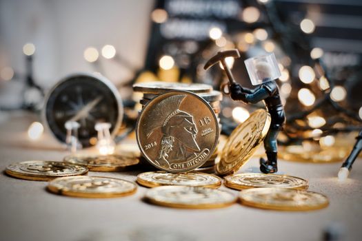 Digital currency physical metal coin. Christmas cryptocurrency concept.