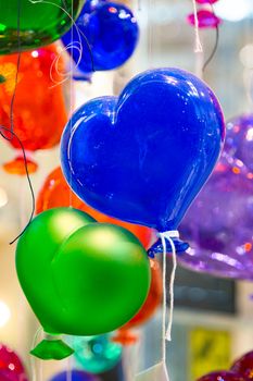 Balloons of Murano glass. Balloons made of Murano glass in the form of hearts. Colorful balloons made of Venetian Murano Glass.