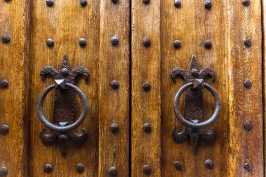 Close up of rustic old door in Spoleto, Italy.