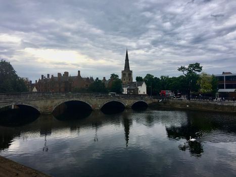 Church in Bedford near the river and bridge. Outdoor town concept.