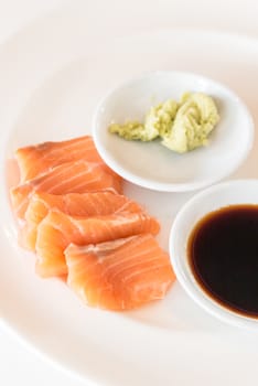 salmon sashimi Japanese gourmet cuisine on white dish 