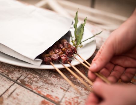 Arrosticini meat for Take away inside an envelope