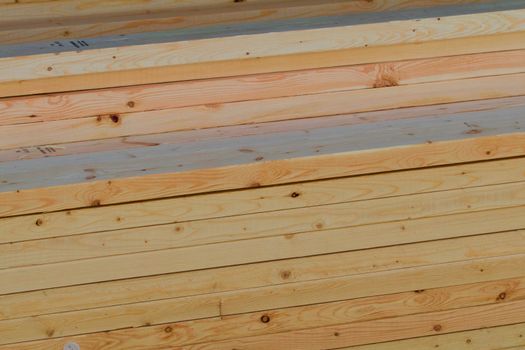 Side view of stacked planks