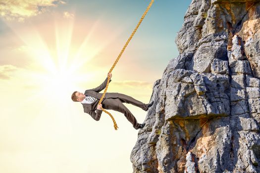 Businessman climb a mountain. Achievement business goal concept