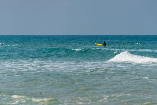 sea landscape man on a surf in the sea