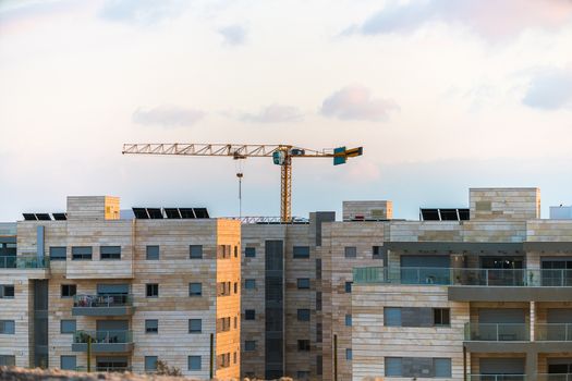 construction work in the desert, crane and building