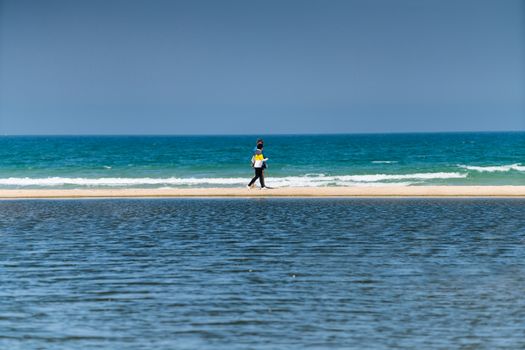 sea landscape, people walk along the seashore