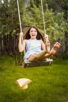 beautiful young brunette woman on the meadow on a warm summer day