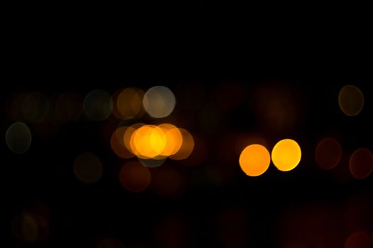 yellow lights on a black background abstraction night city