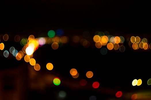 yellow lights on a black background abstraction night city