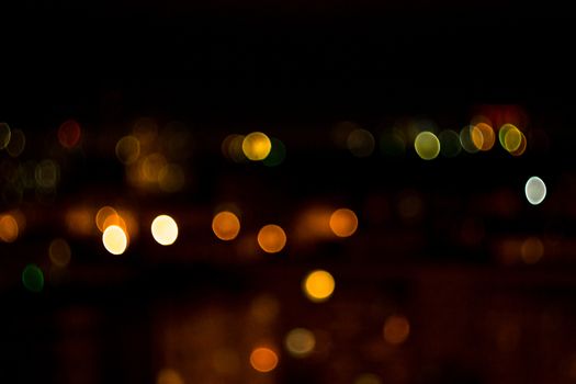 yellow lights on a black background abstraction night city