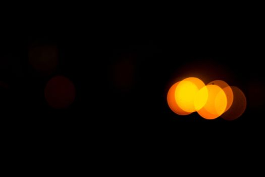 yellow lights on a black background abstraction night city