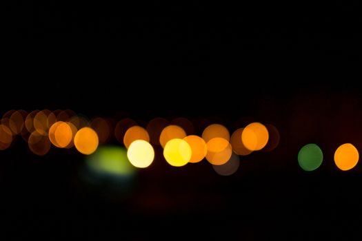 yellow lights on a black background abstraction night city