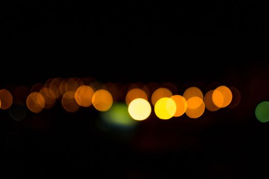 yellow lights on a black background abstraction night city