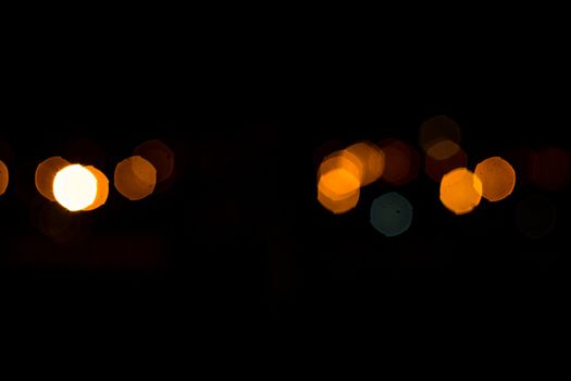 yellow lights on a black background abstraction night city