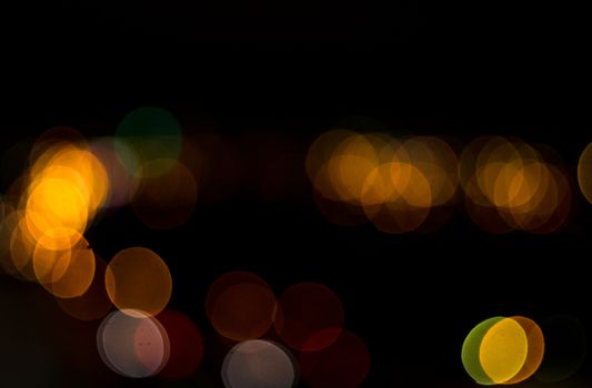 yellow lights on a black background abstraction night city