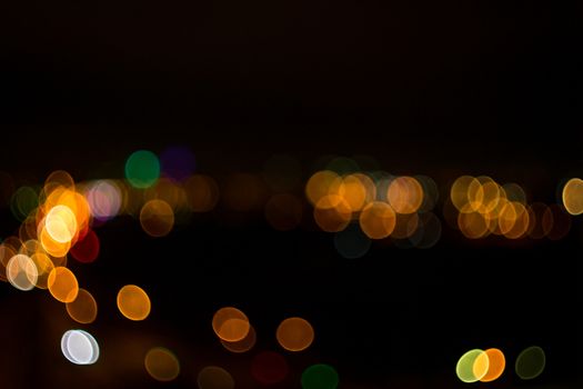 yellow lights on a black background abstraction night city