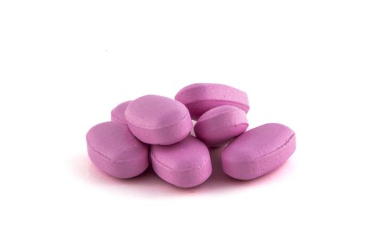 pink pill heap isolated on white background