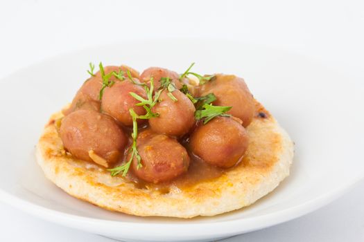 Traditional Colombian arepa topped with beans