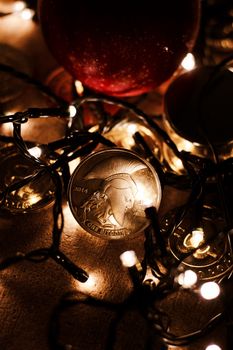 Digital currency physical metal bitcoin coin. Christmas cryptocurrency concept.