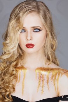 Fashion makeup. Woman with colorful makeup and body art.