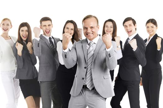 Successful excited business people group team standing together and holding fist ok yes gesture isolated over white background