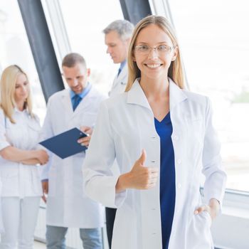 Young female doctor and medical team in hospital